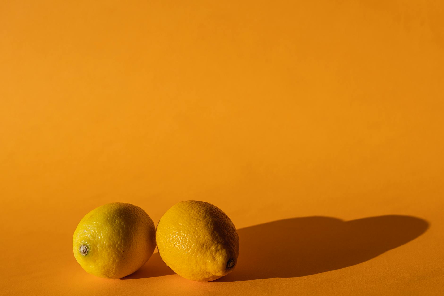 Woman holding a fresh lemon, representing renewal and fresh starts after betrayal